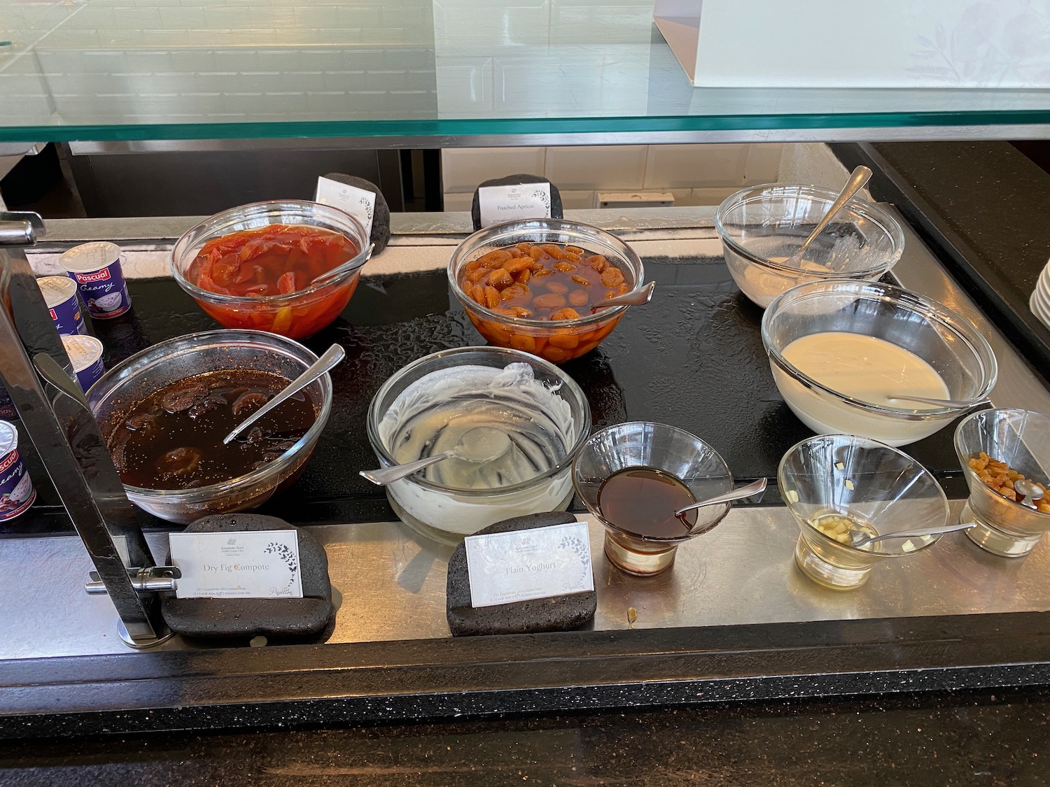 a group of bowls of food on a counter