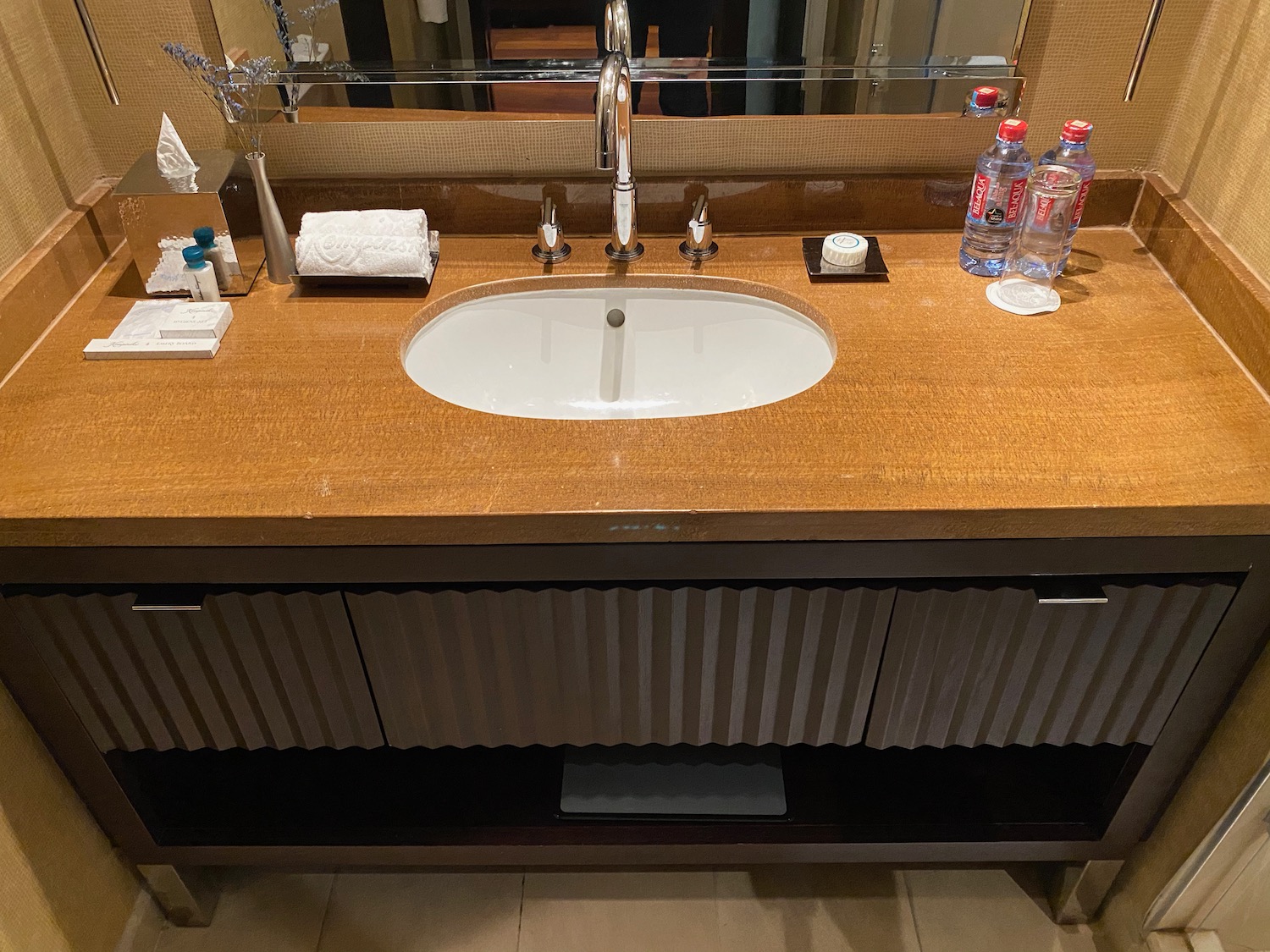 a bathroom sink with a mirror above it