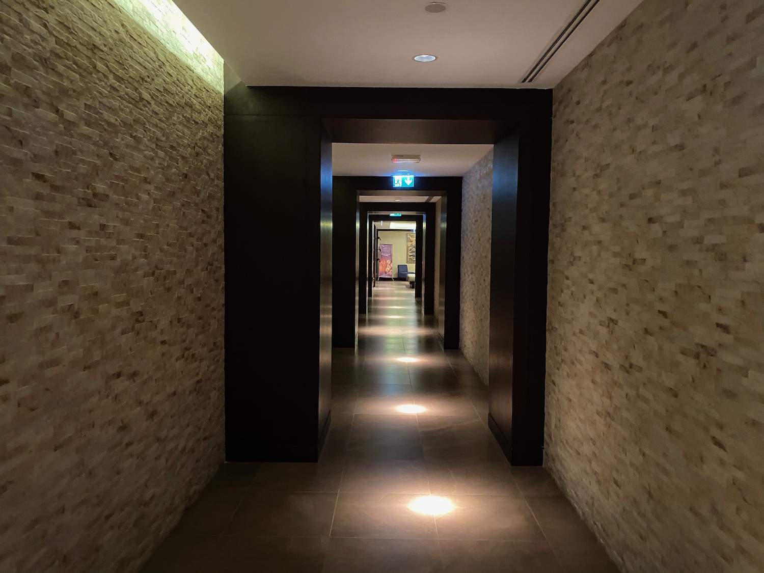 a hallway with lights on the floor