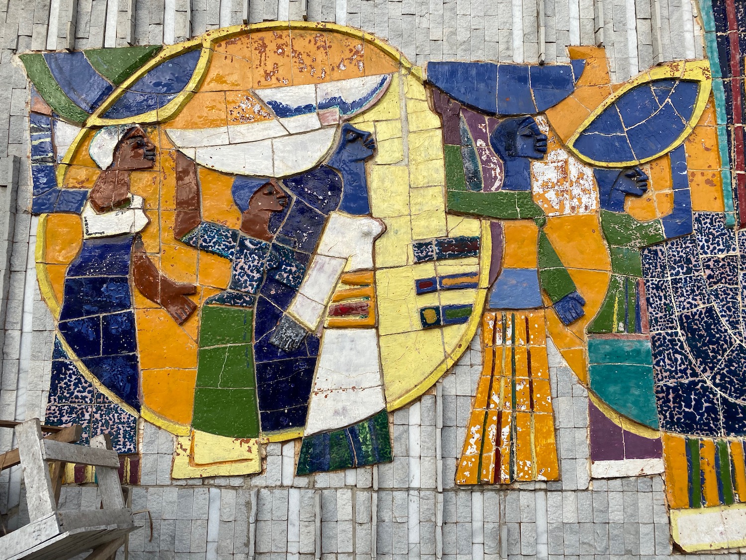 a mural of people holding baskets