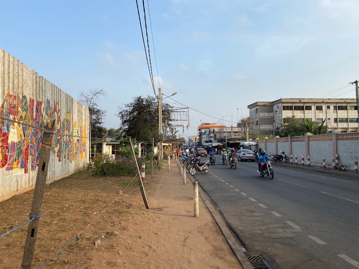 a group of people riding motorcycles on a road