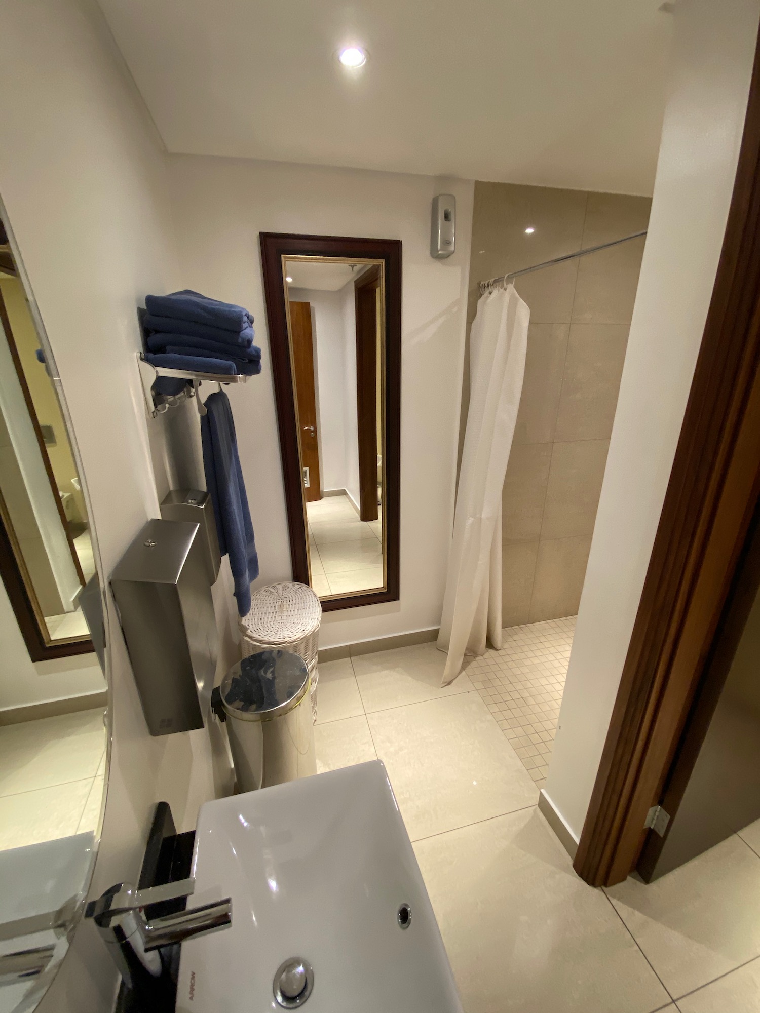 a bathroom with a mirror and a toilet