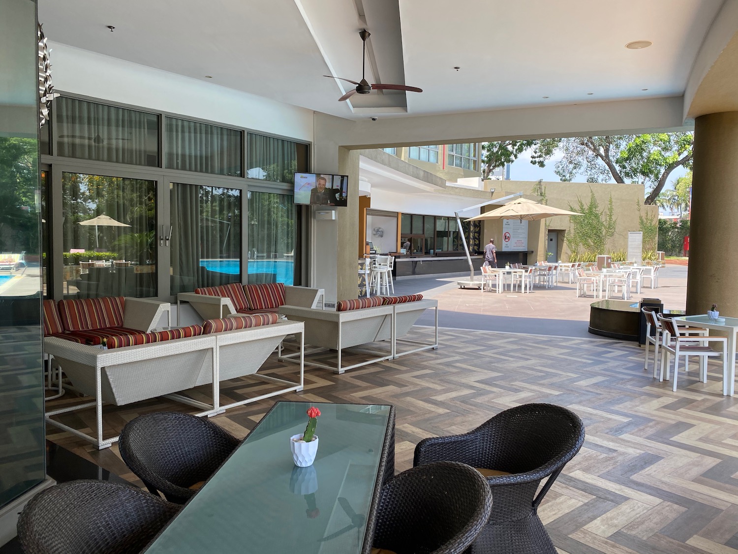 a patio with chairs and tables