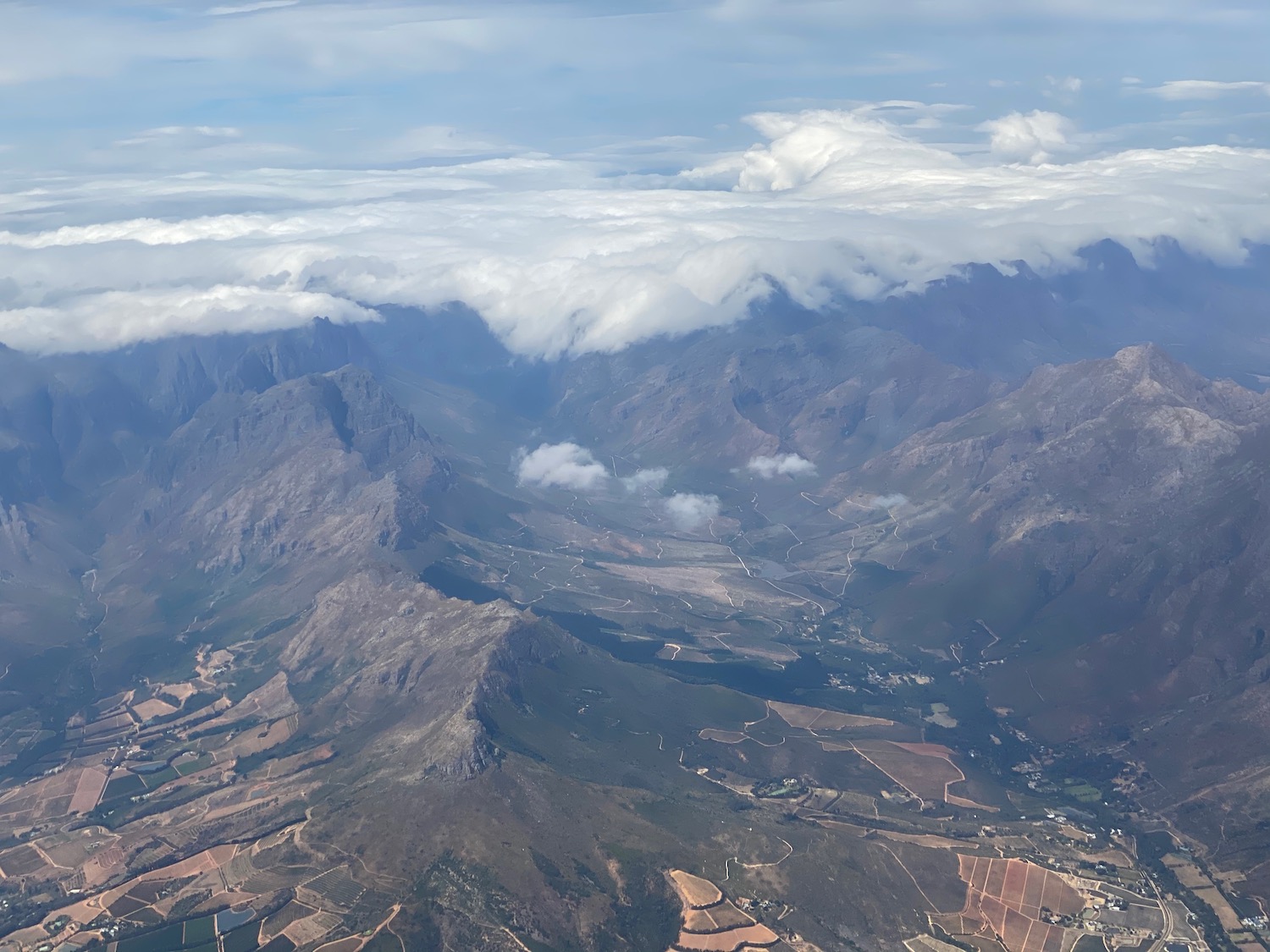 aerial view of a valley with clouds