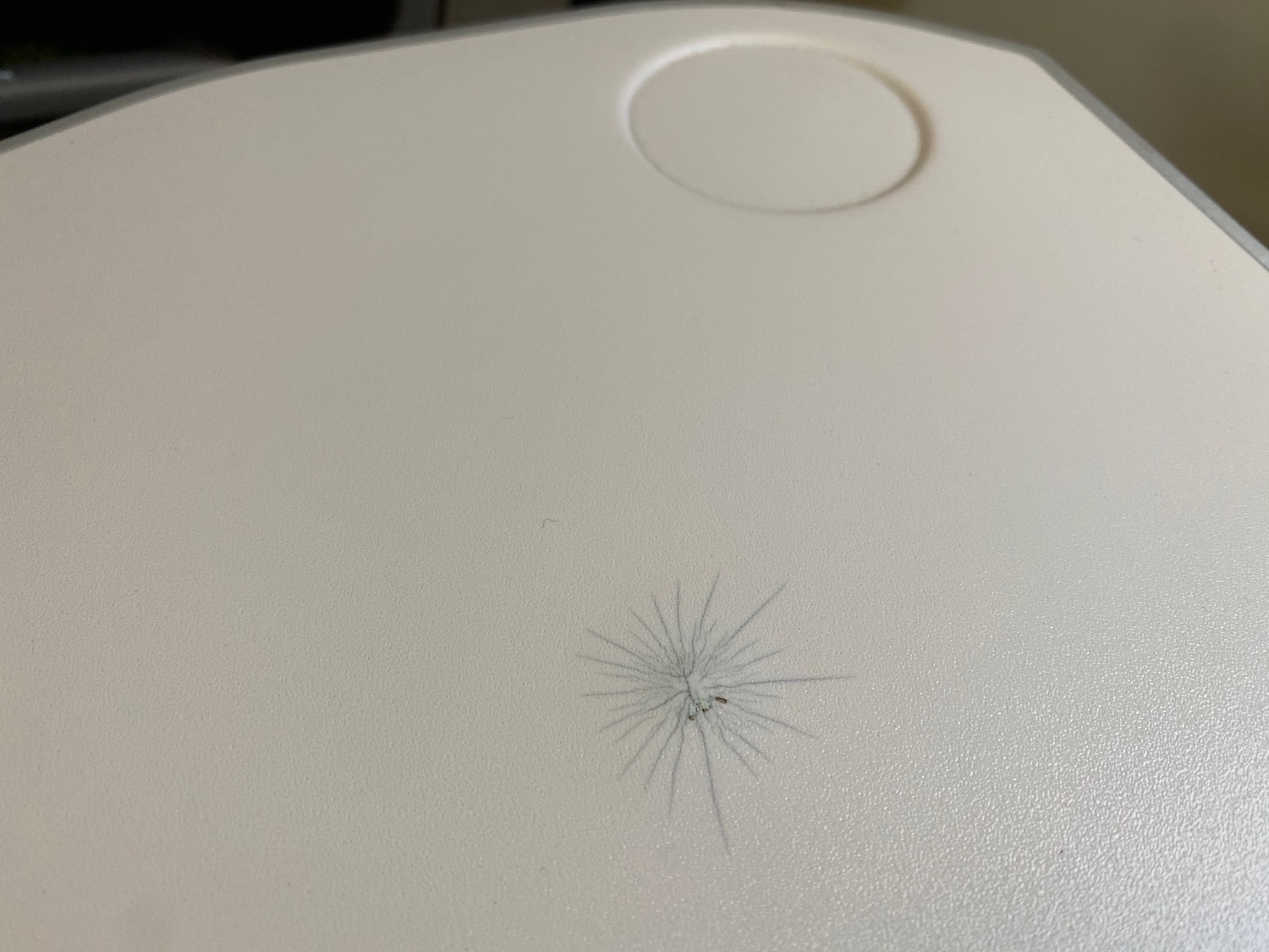 a white surface with a crack in it