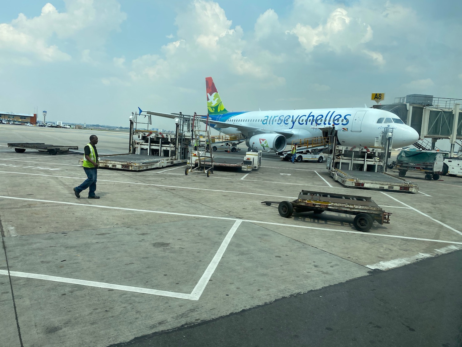 a man walking next to an airplane