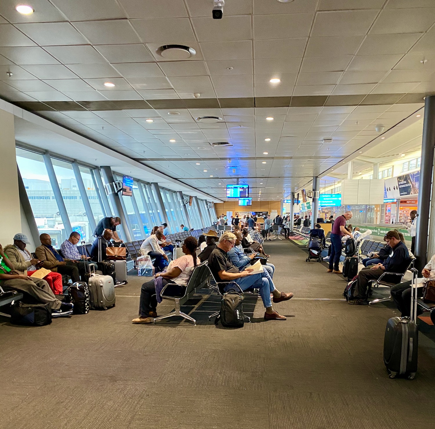 a group of people sitting in a terminal