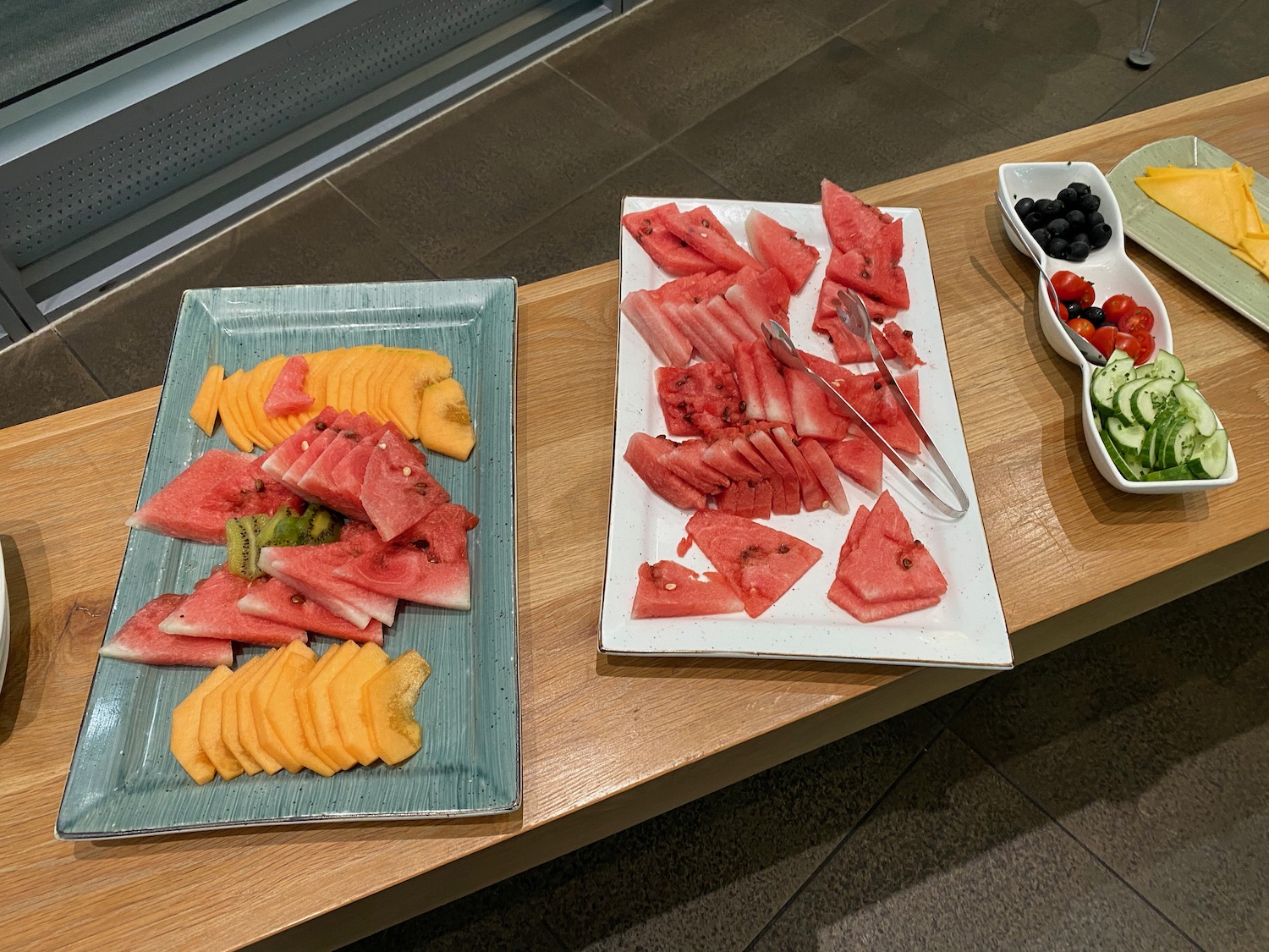 a plate of watermelon and fruit on a table