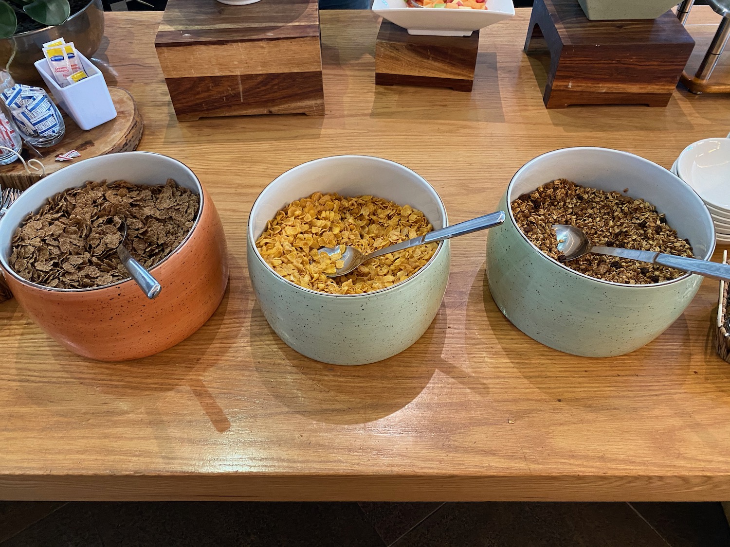 a group of bowls of cereal with spoons