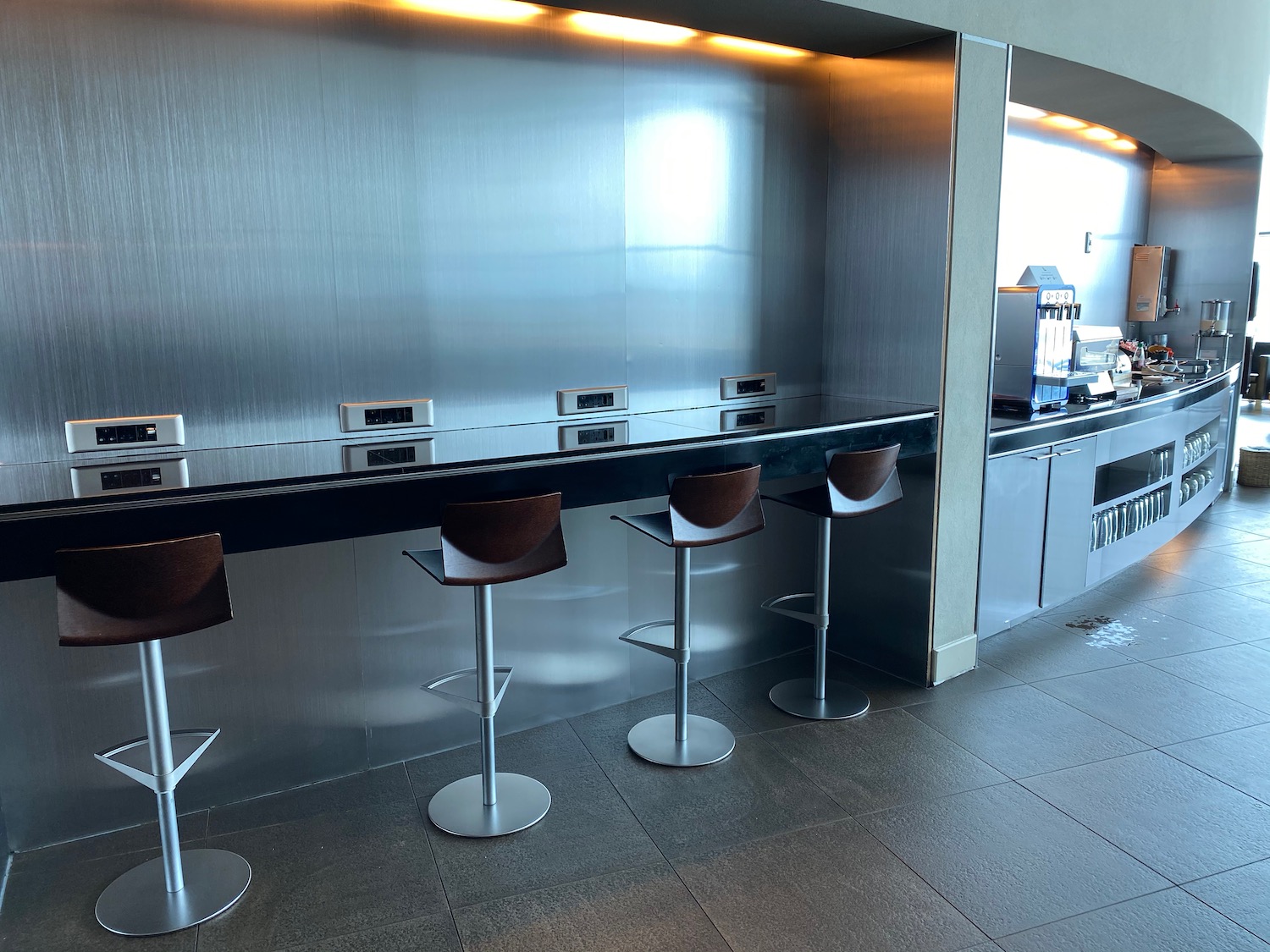 a bar with chairs in a room