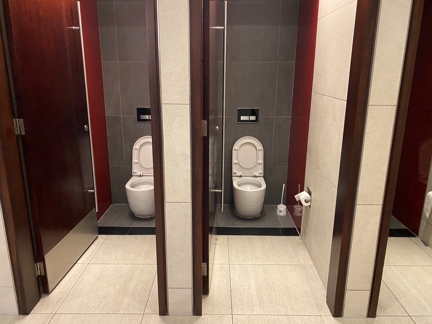 a bathroom with two toilets