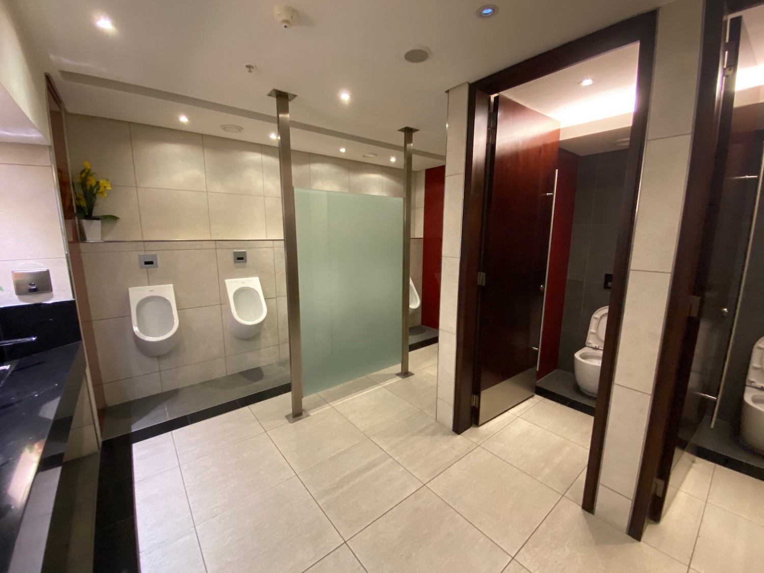 a bathroom with urinals and two urinals
