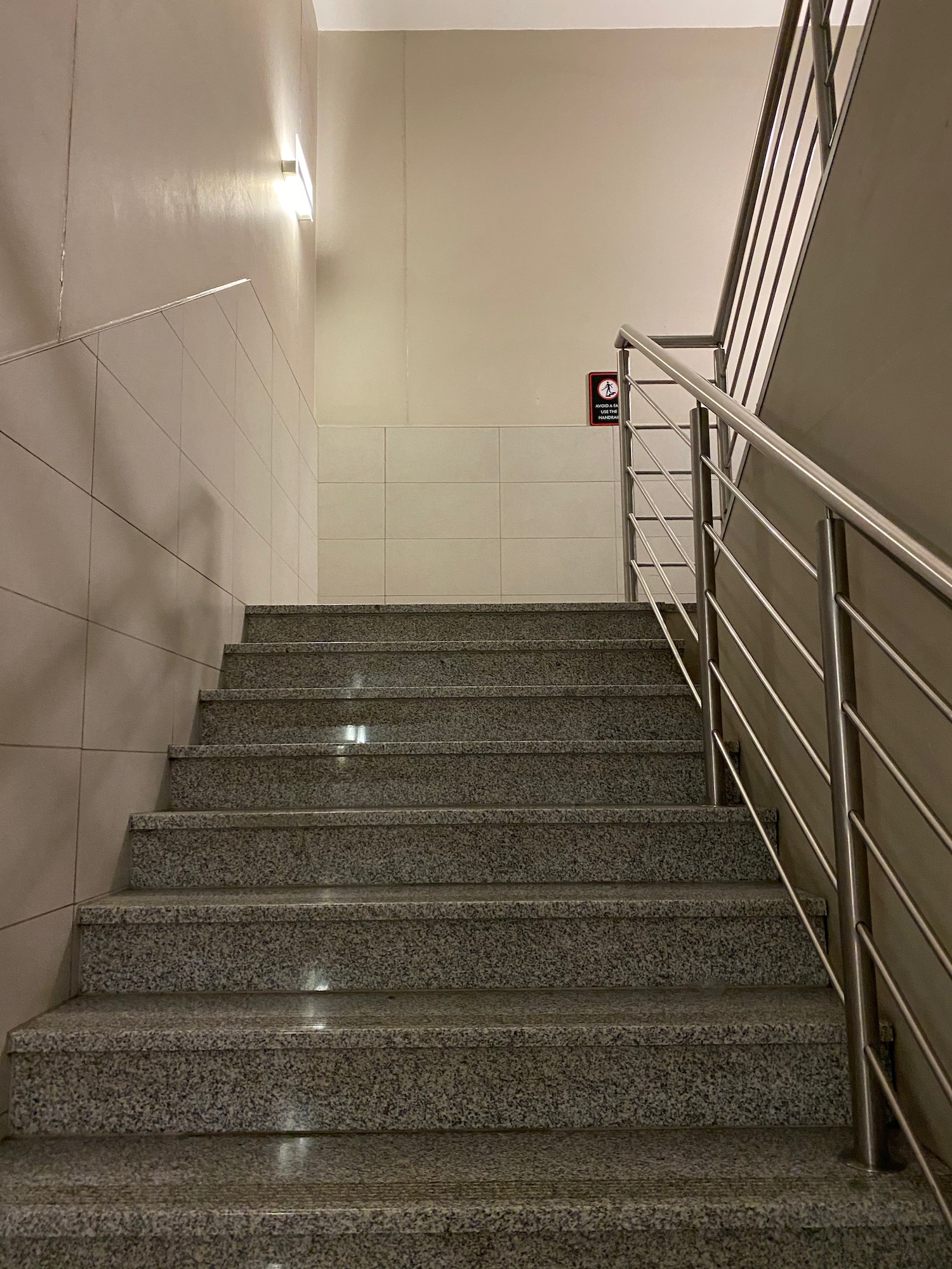 a staircase with a metal railing