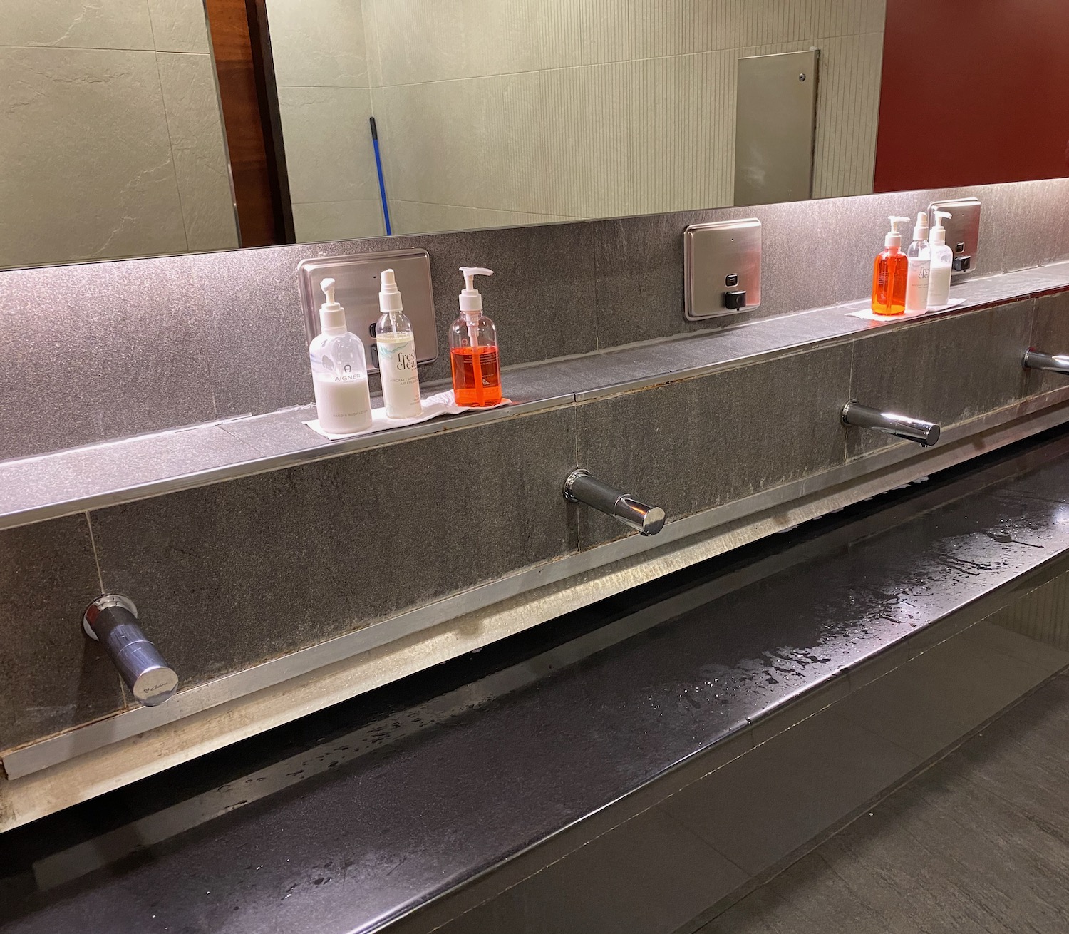 a row of hand wash basins