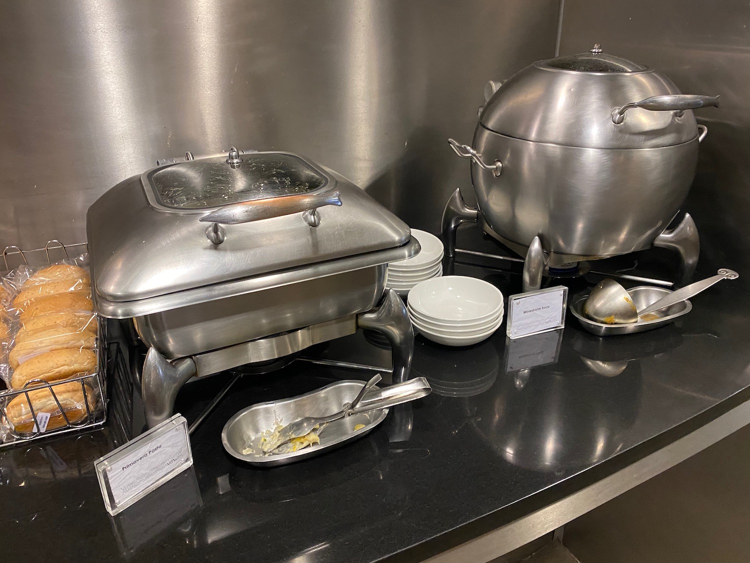 a group of silver containers on a counter