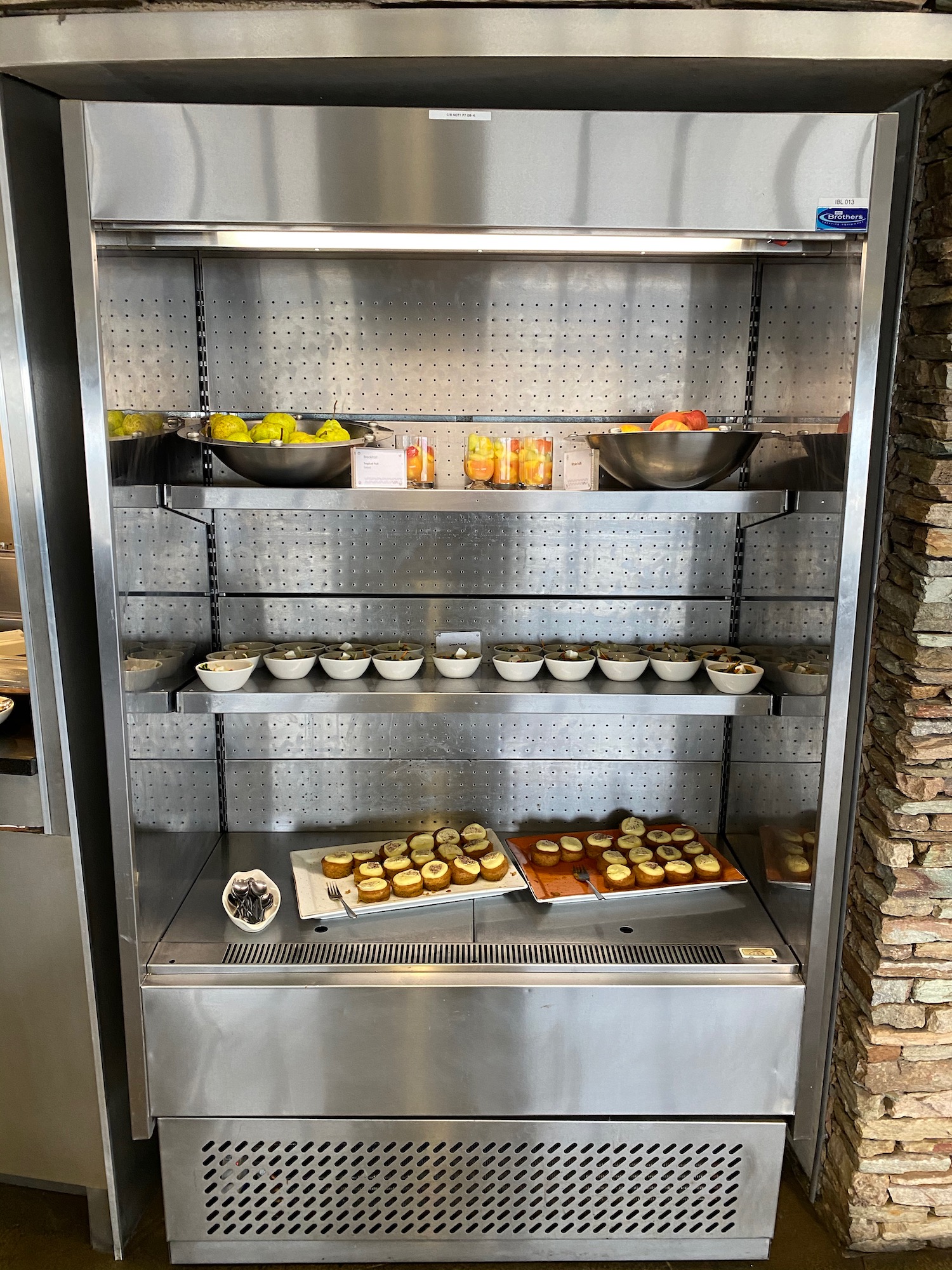 a refrigerator with food on shelves