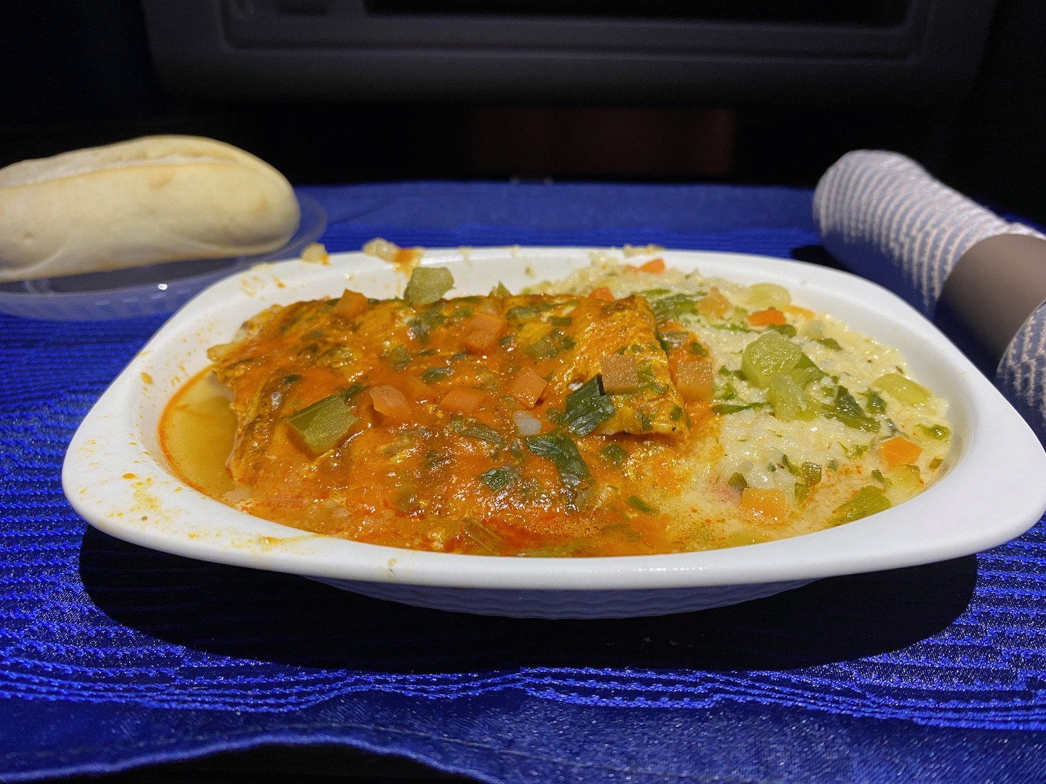 a bowl of food on a blue surface