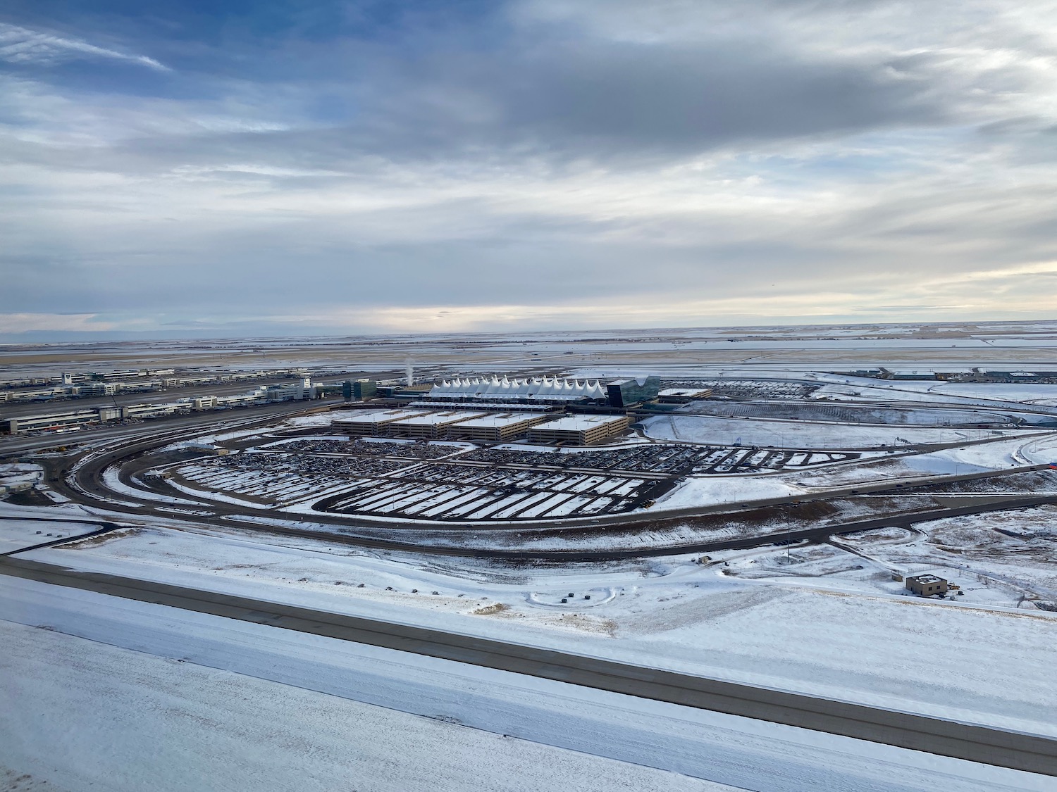 a landscape with snow and buildings