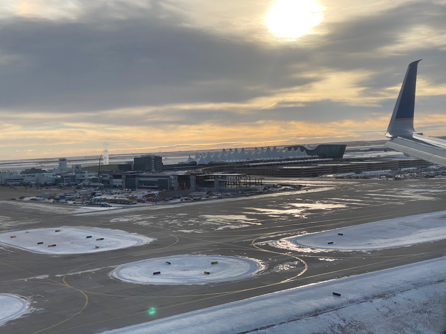 an airport with snow on the ground