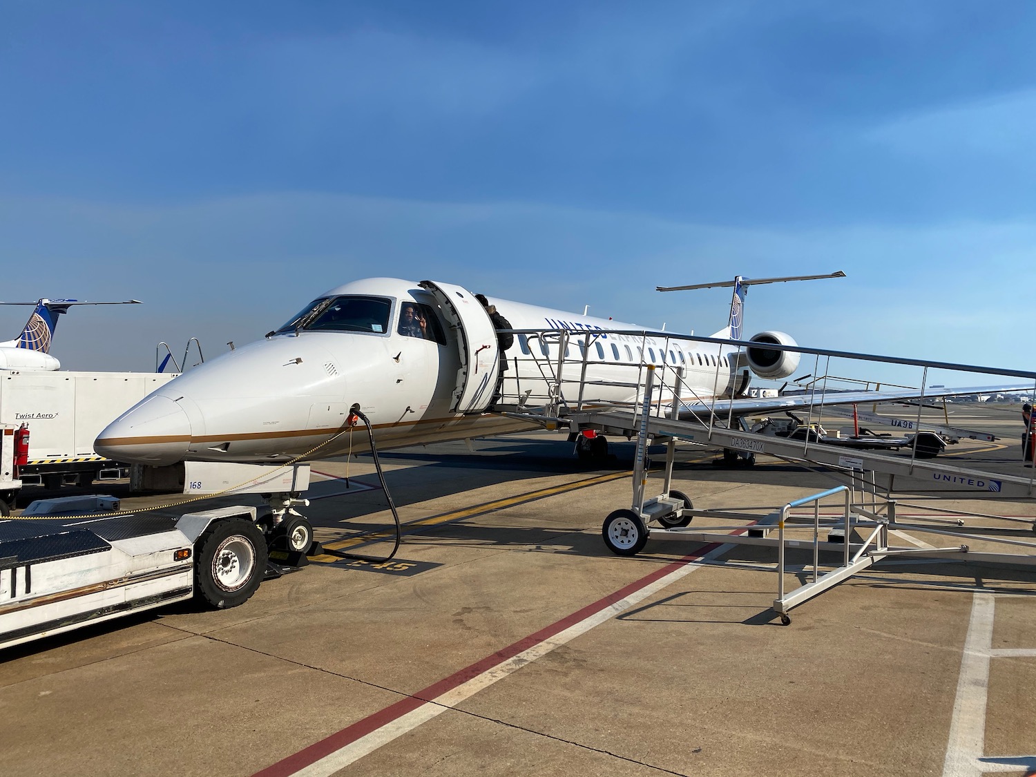 a white airplane on a tarmac