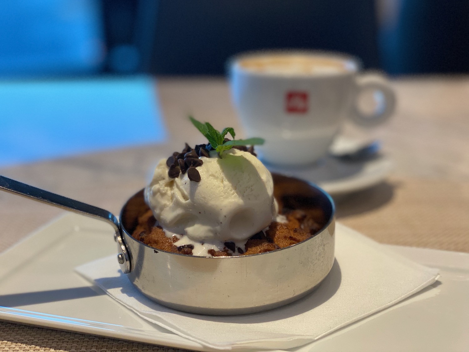 a small skillet with ice cream and chocolate chips