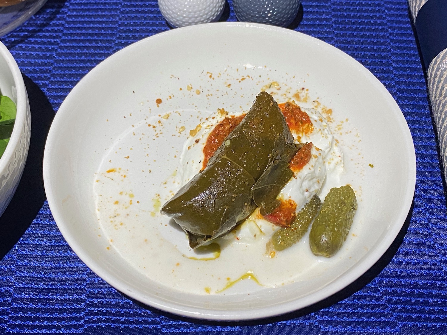 a plate of food on a blue place mat