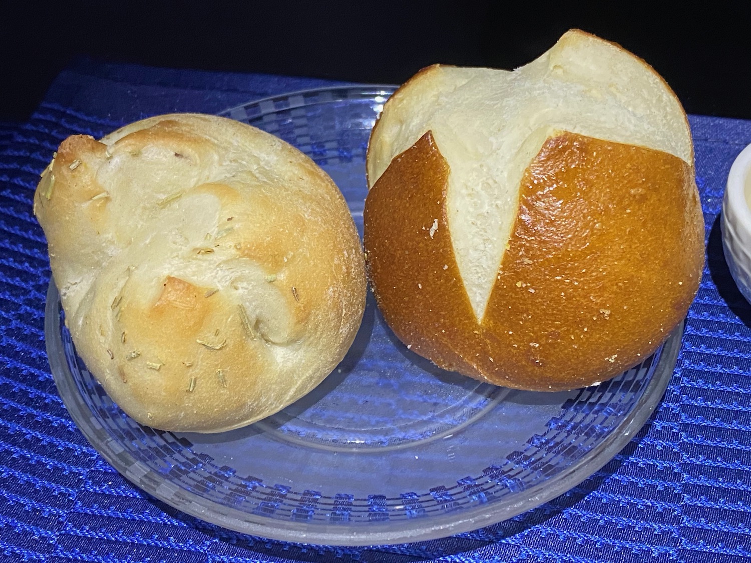 a plate of bread on a blue surface