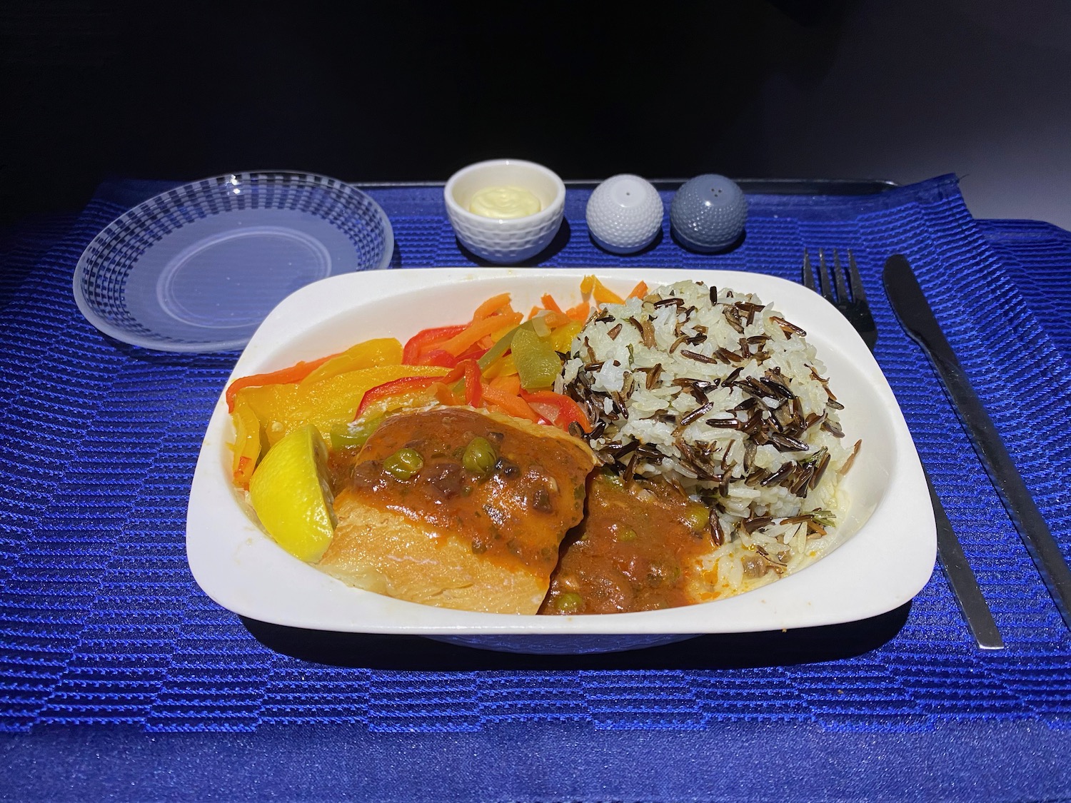 a plate of food on a blue surface