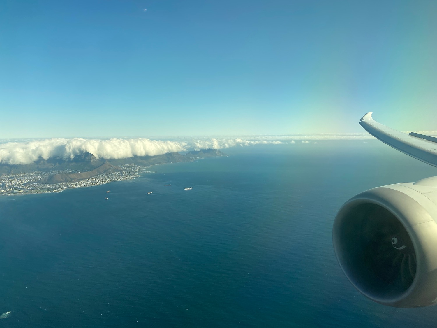 an airplane wing and body of water