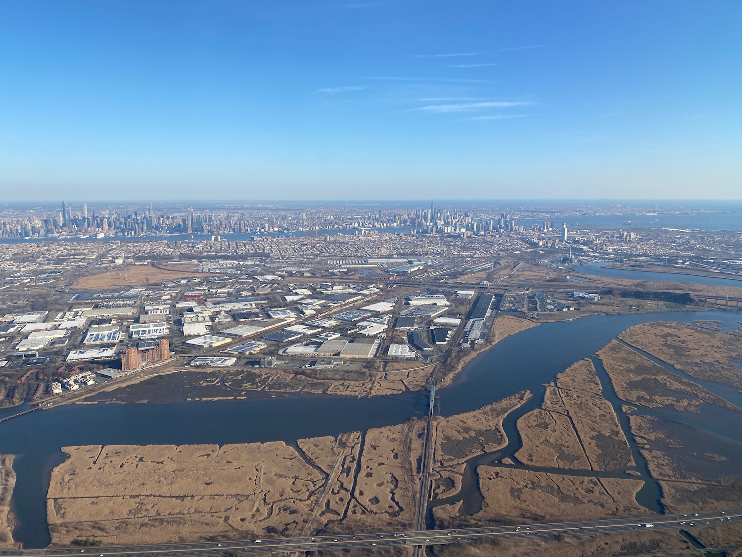 a city with a river and a city in the background