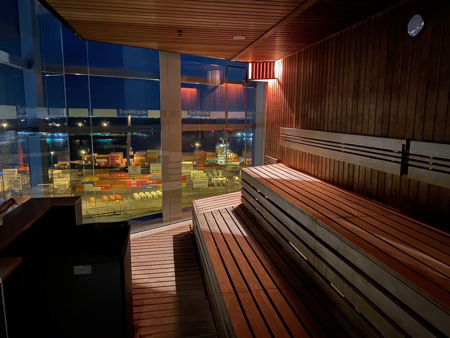 a wooden bench in a room with a window