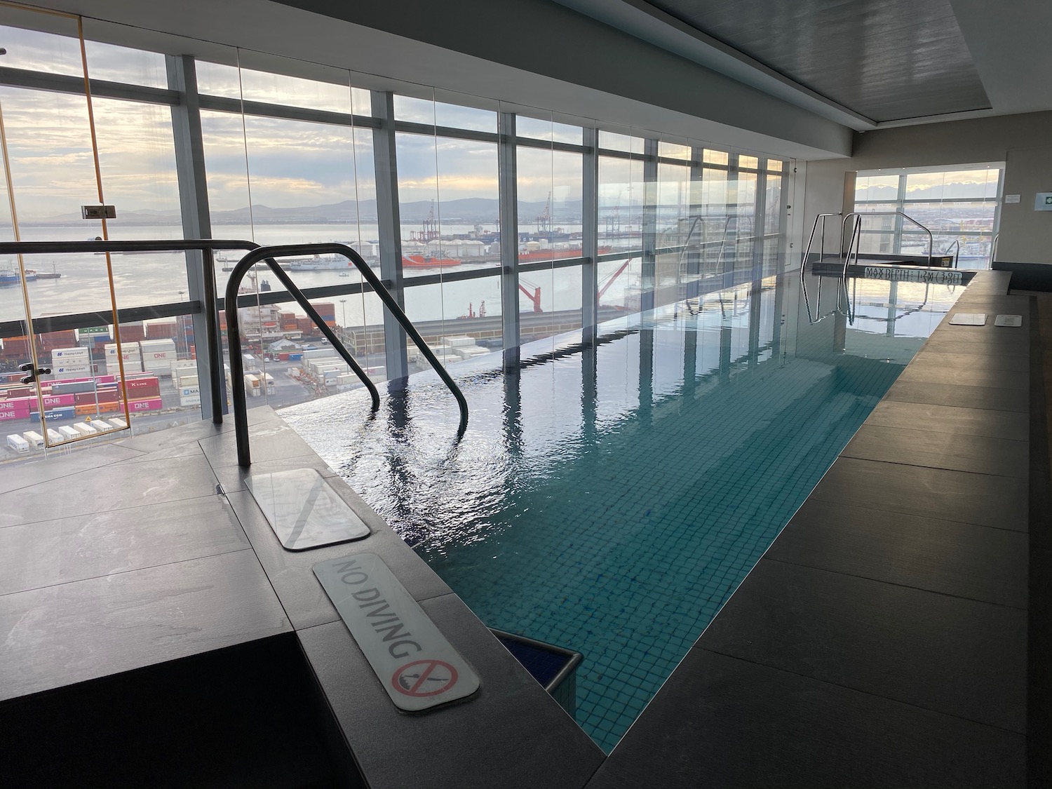 a indoor swimming pool with a large window