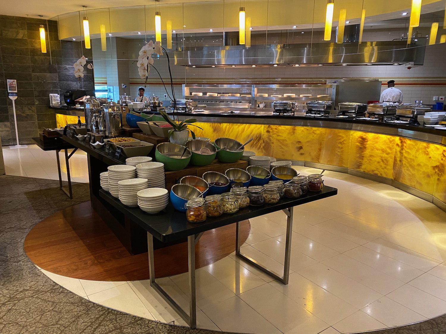 a buffet table with bowls and bowls