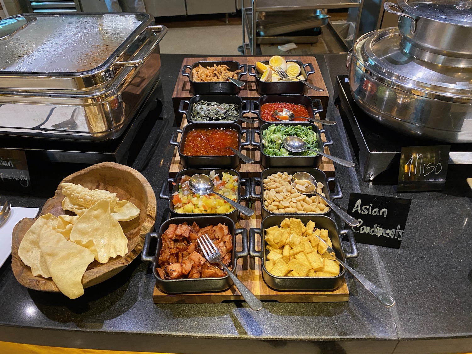 a buffet table with food in containers