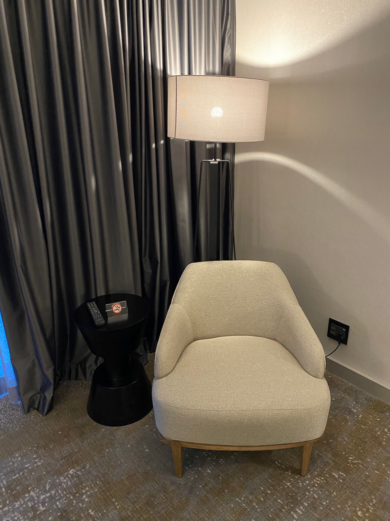 a chair next to a lamp