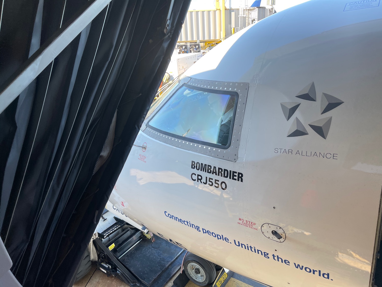 a white airplane in a hangar