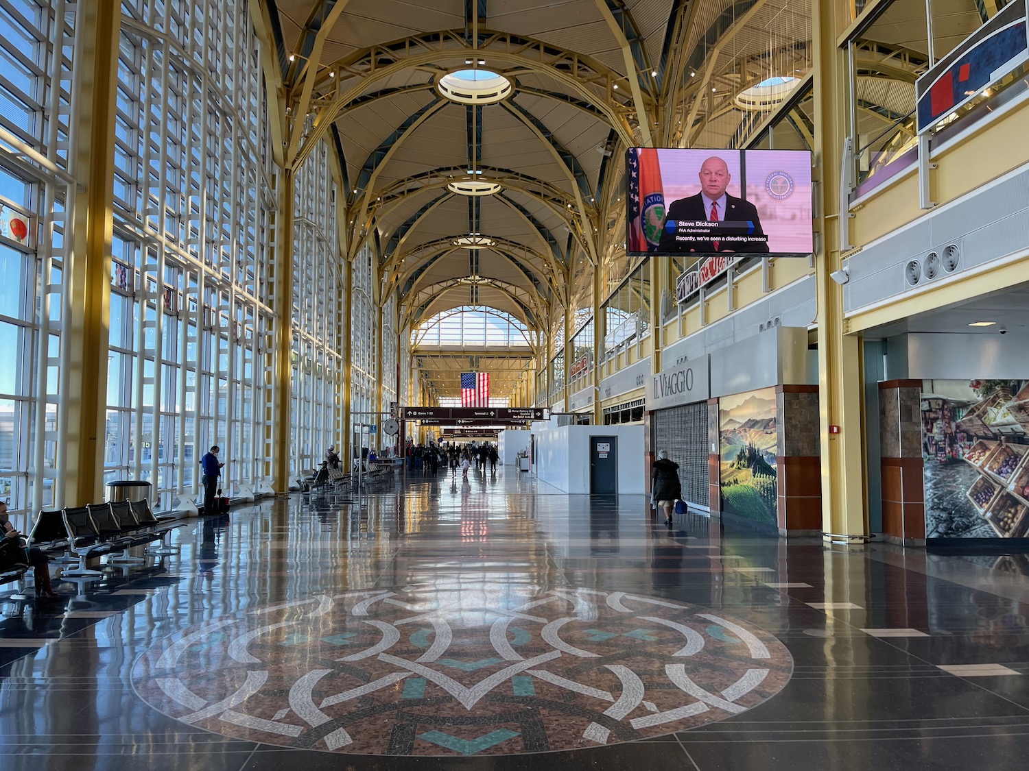 a large building with a tiled floor and a television screen