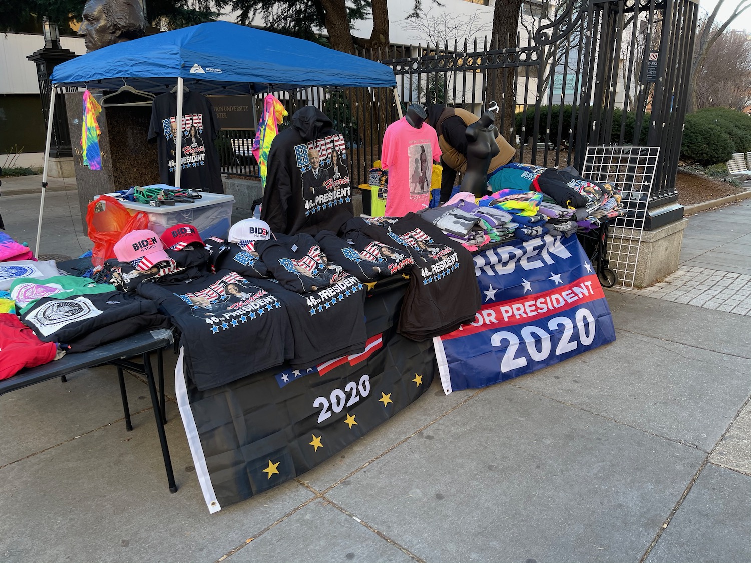 a table with t-shirts and flags on it
