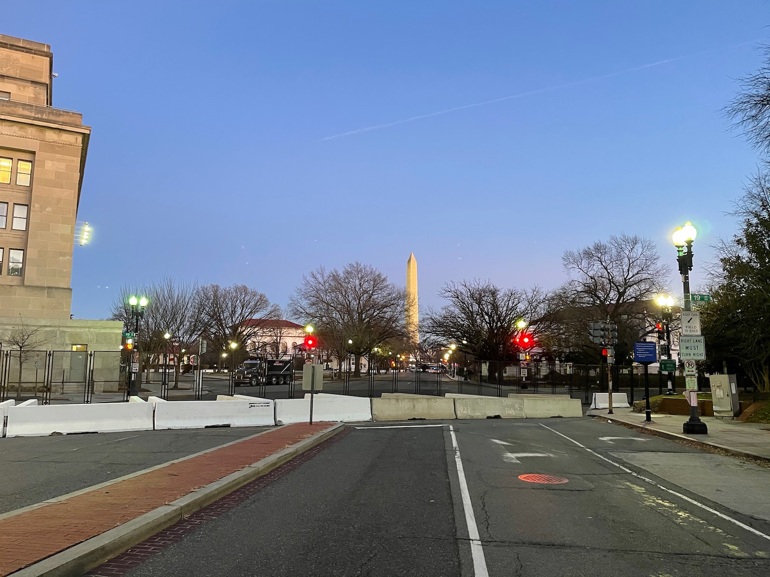 a street with a monument in the background