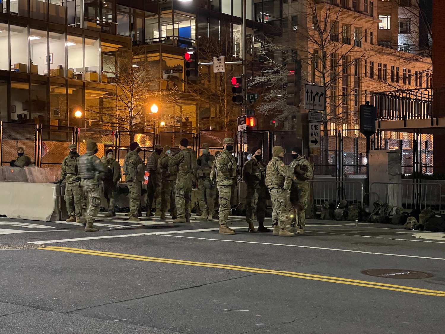 a group of soldiers standing in a line on a street