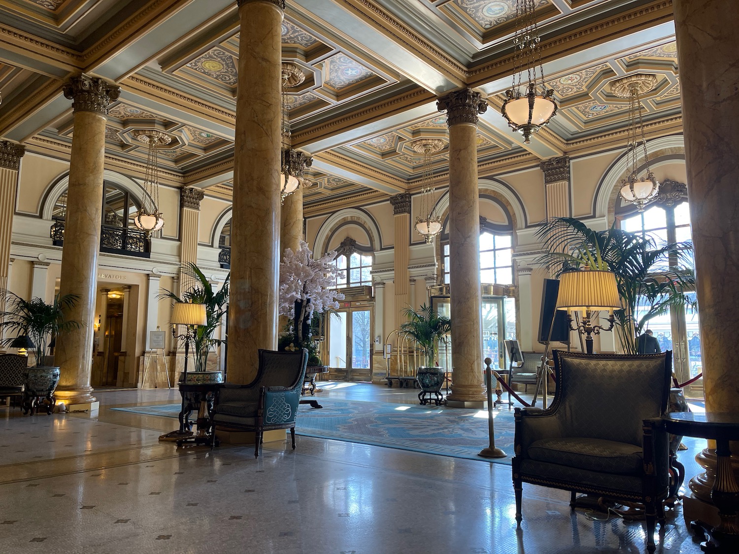 a large room with columns and chairs