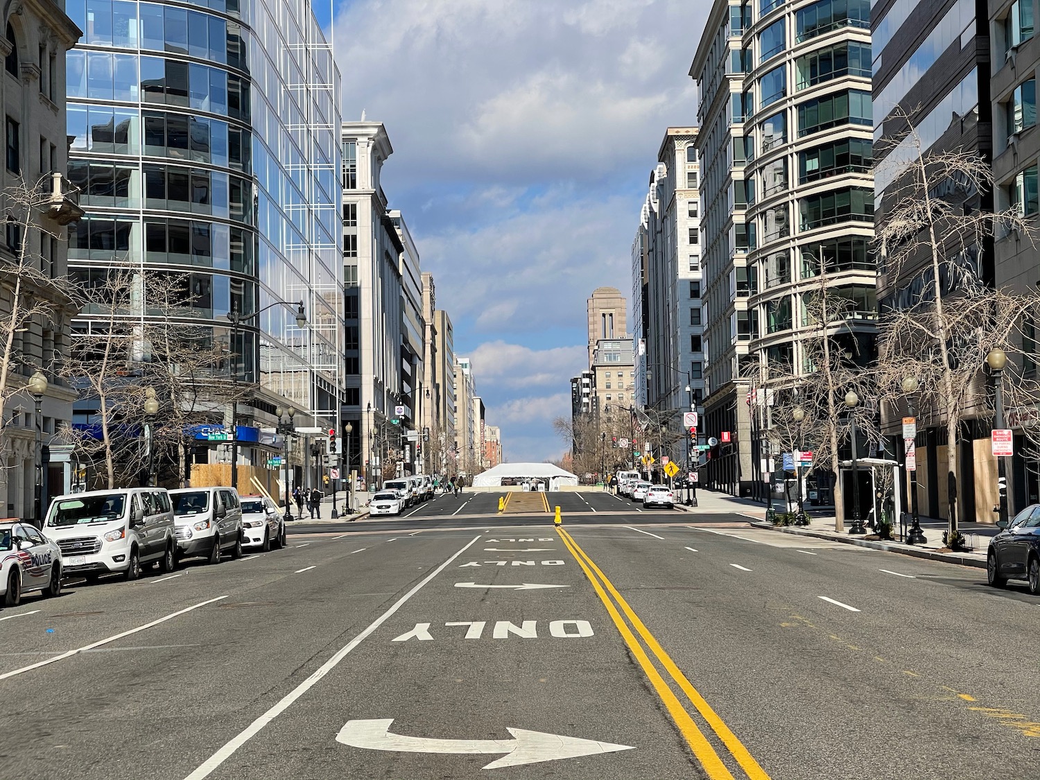 a street with cars and buildings