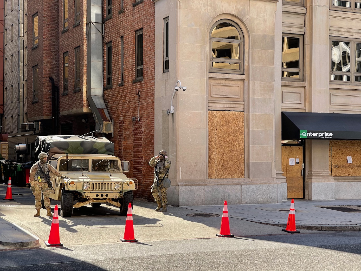 a military vehicle parked on the side of a street