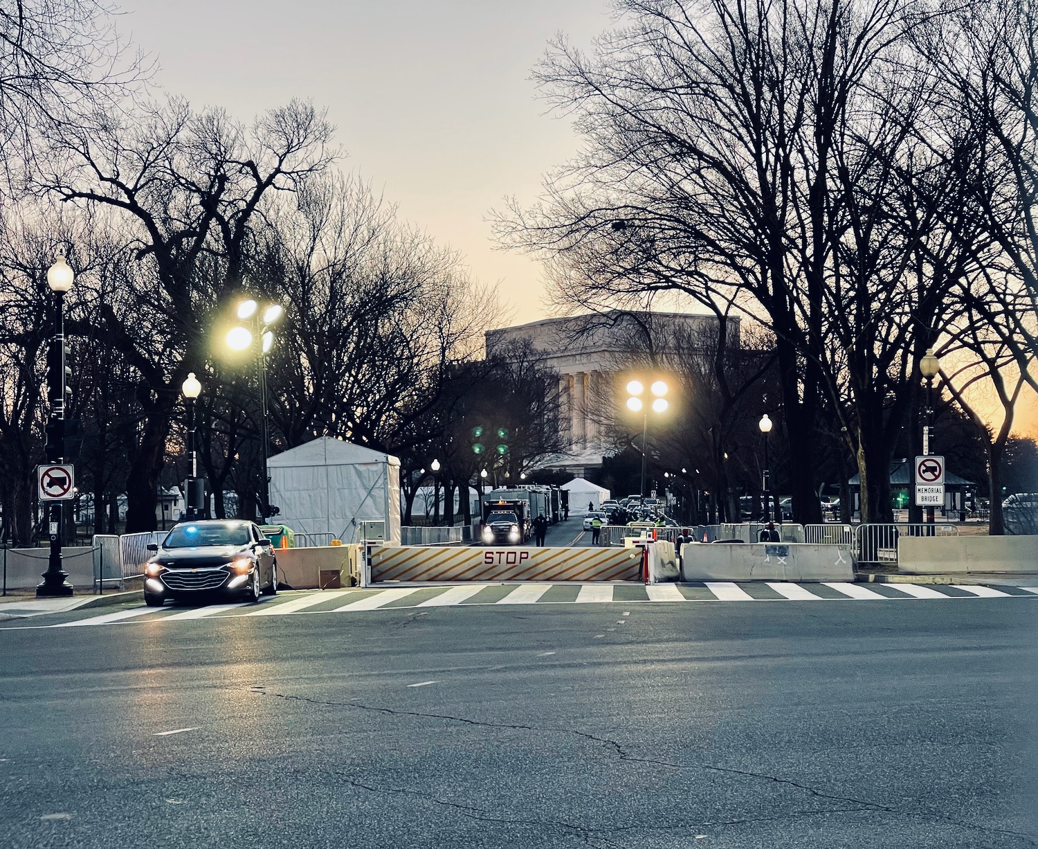 a street with cars and trees