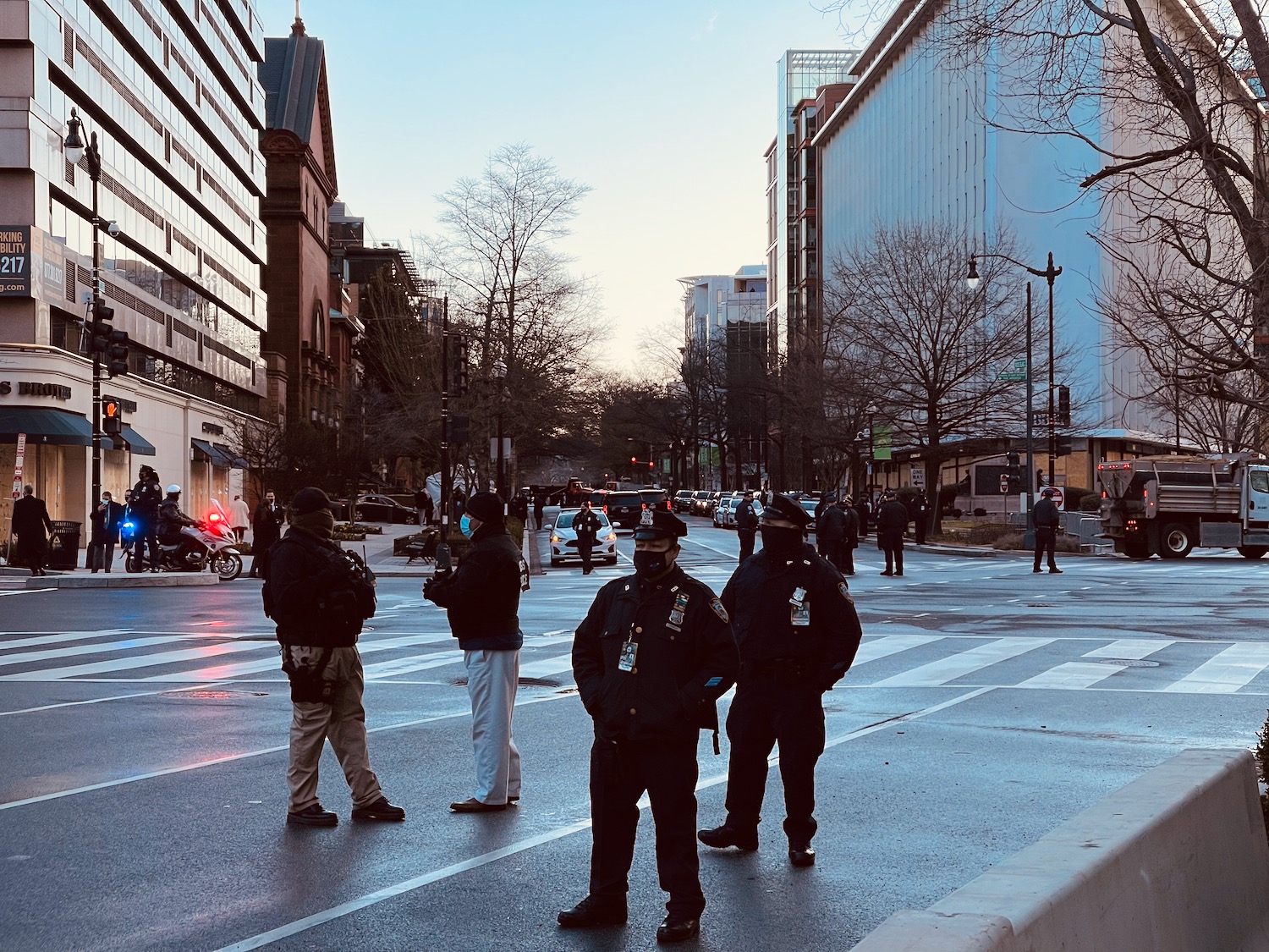 a group of police officers standing on a street