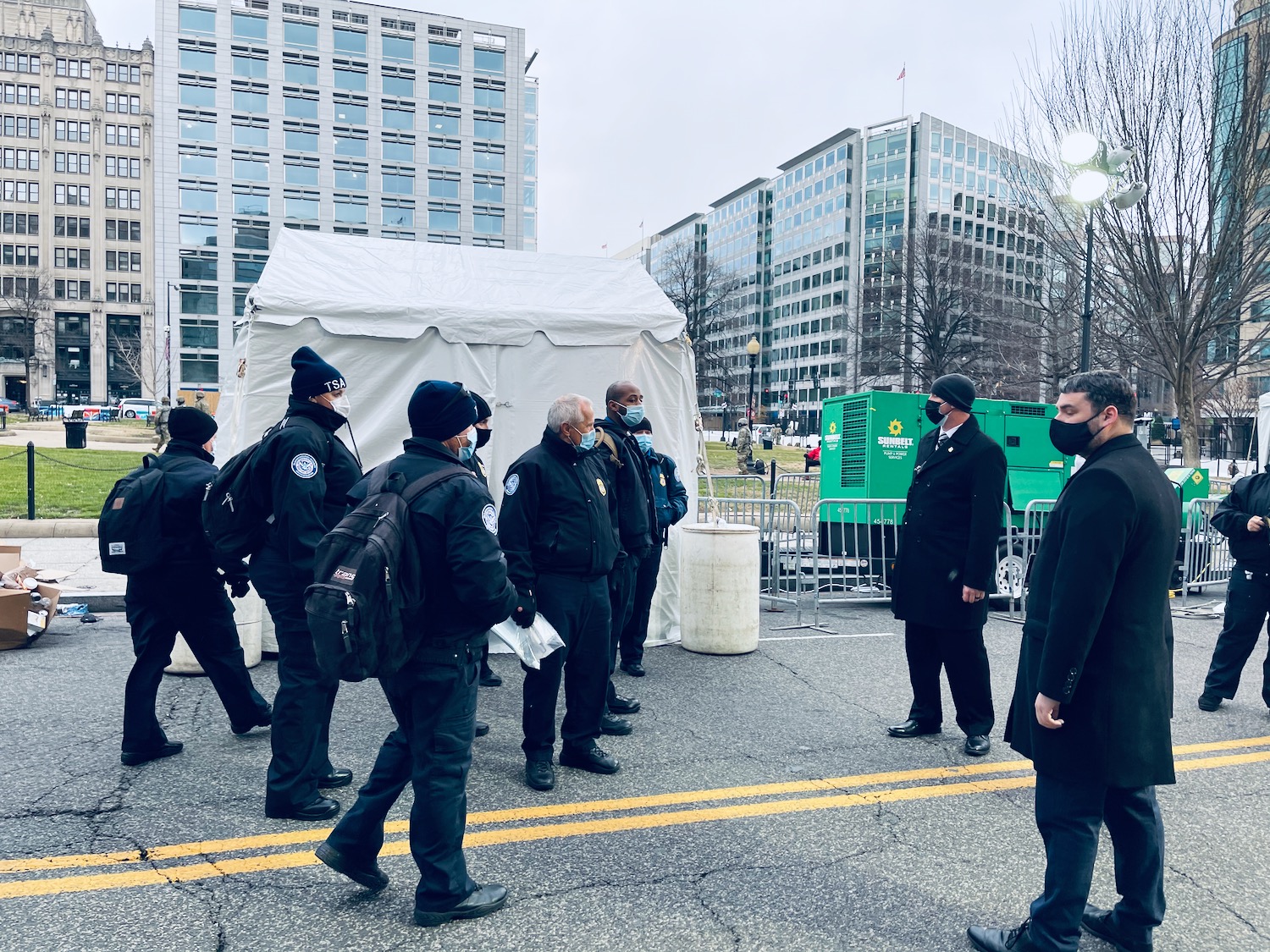 a group of people in black uniforms