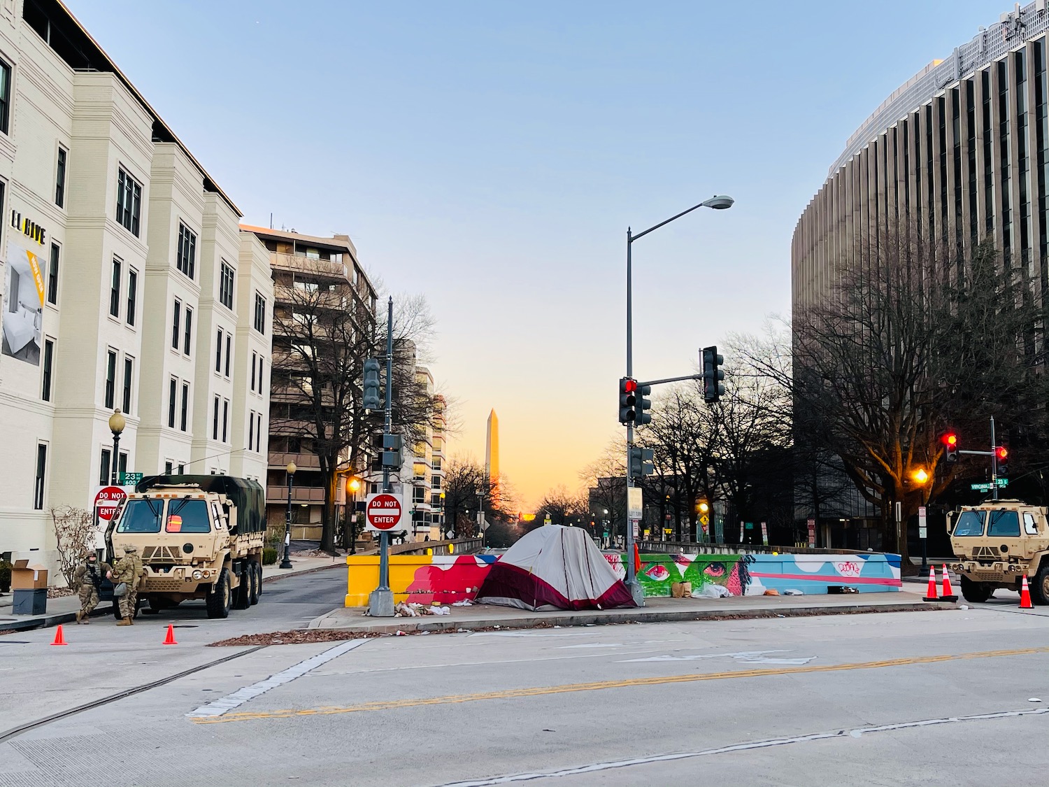 a street with a tent and buildings