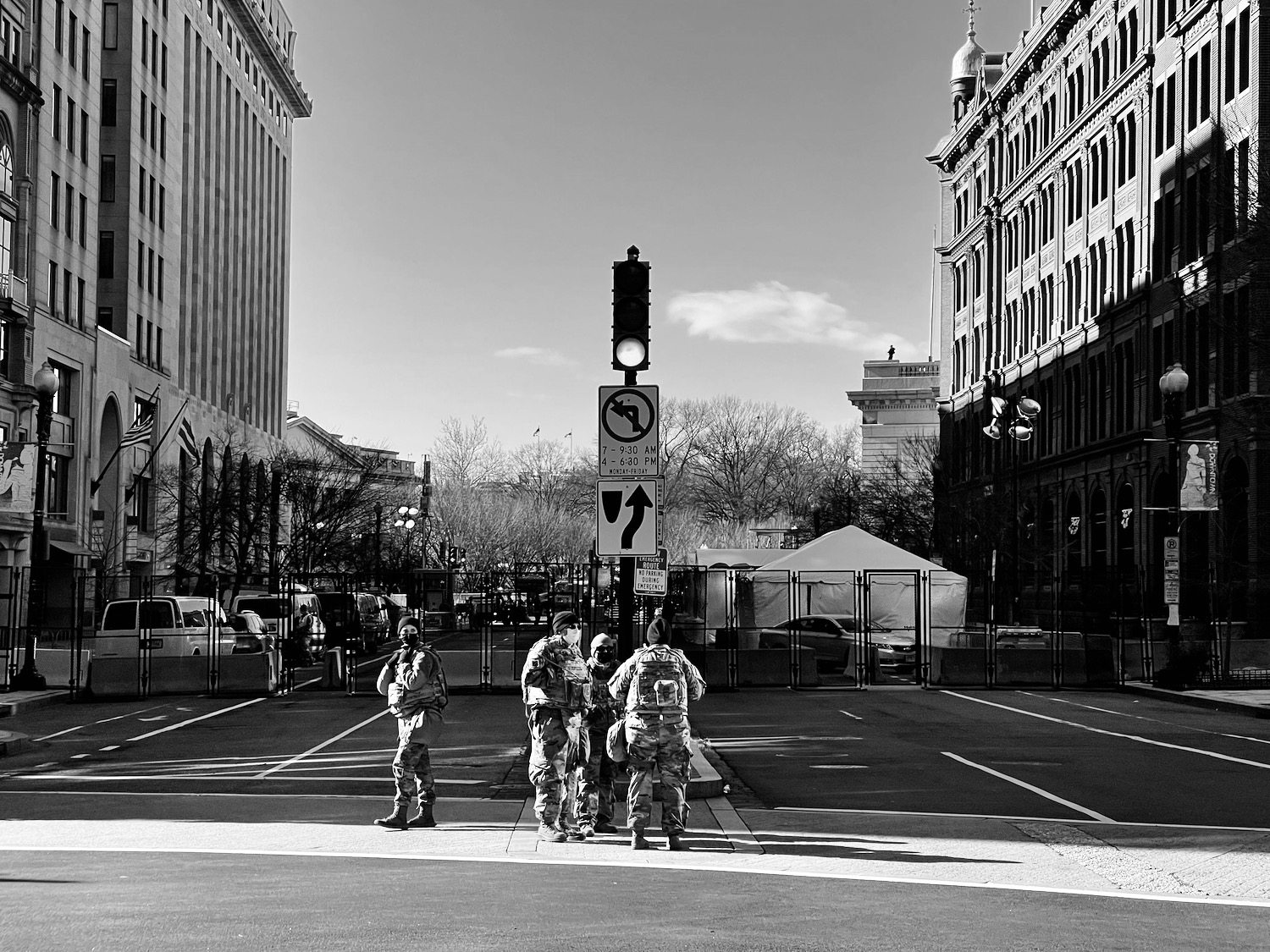 a group of people in uniform standing in a street