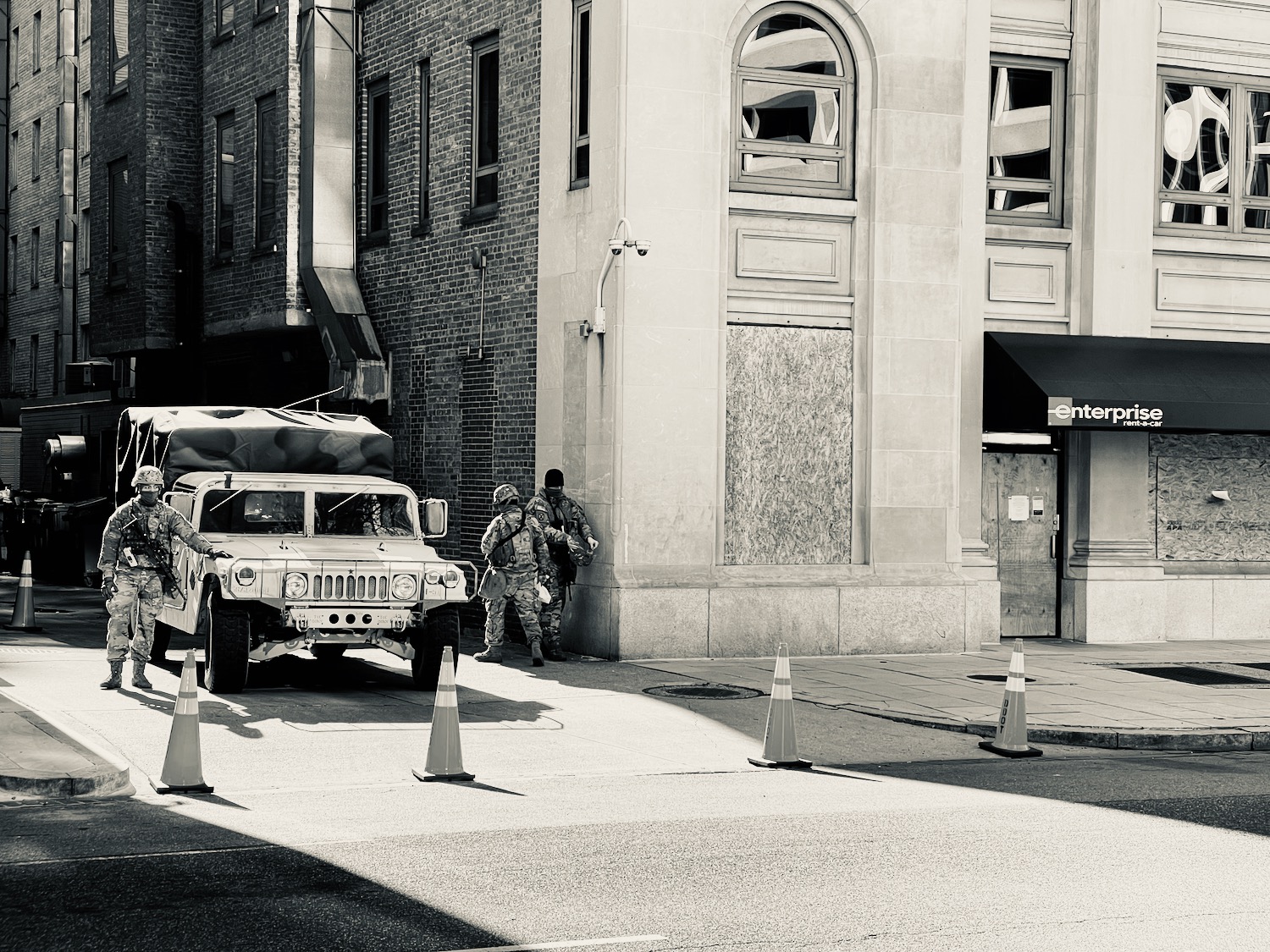 a military vehicle parked on the side of a street