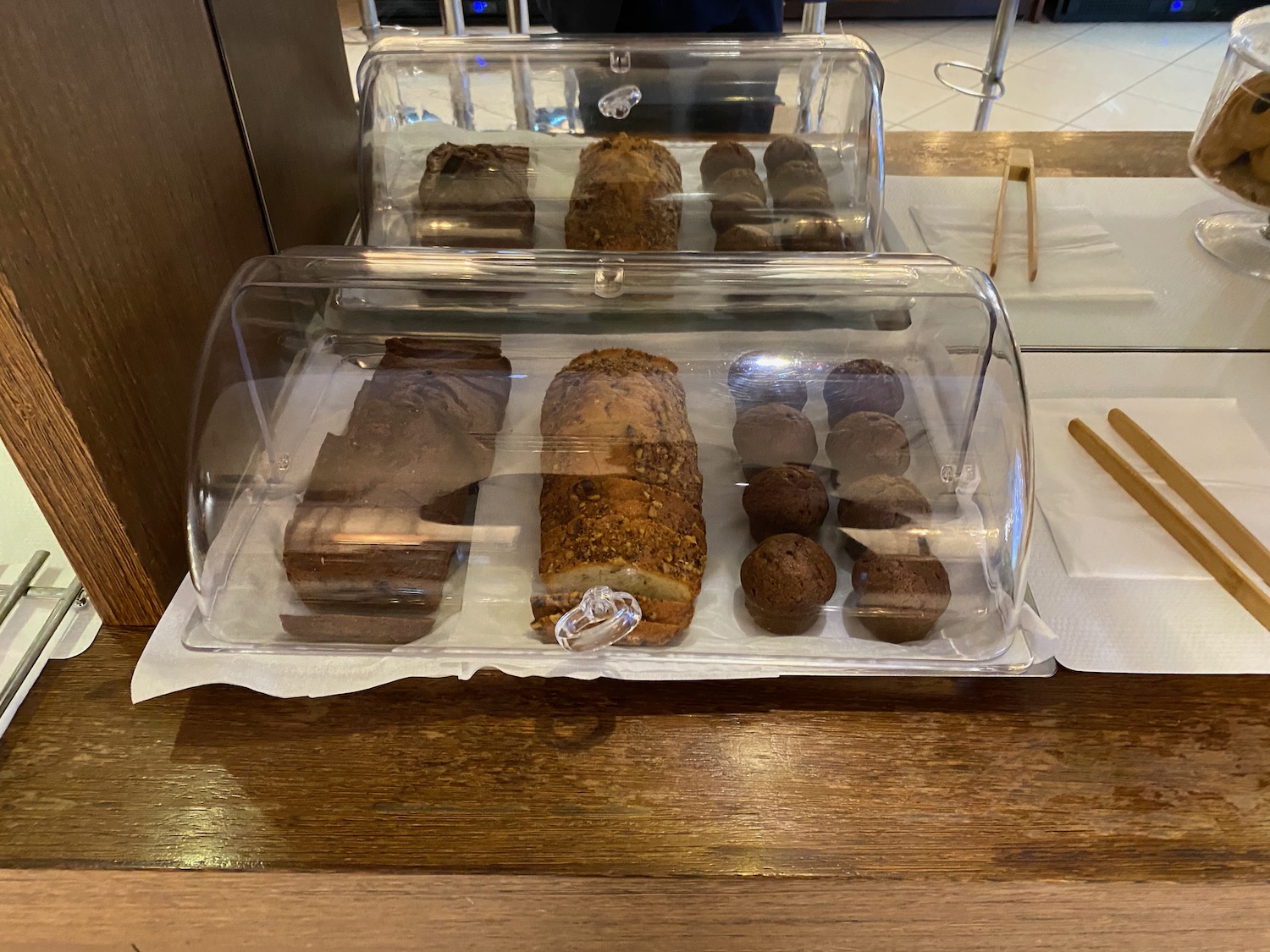 a glass case with food on it